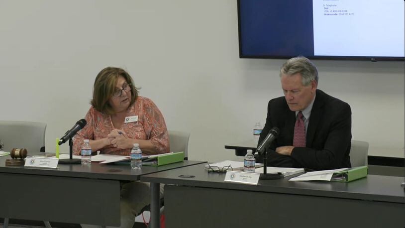 Gwinnett Election Board Chairwoman Alice O'Lenick debates board member Stephen Day during a meeting on challenges to voter eligibility on Monday. The board voted 3-2 to dismiss the challenges. Credit: Gwinnett County livestream
