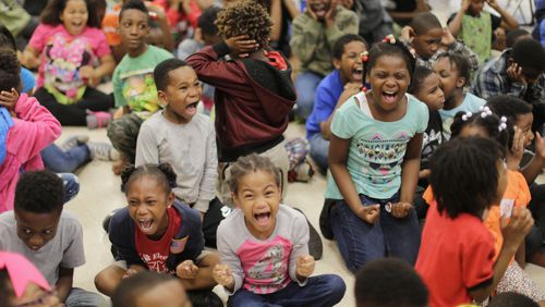 April 29,  2016 -  DeKalb County - Students scream as loud as they can so the rest of the school can hear them as the attendance parade gets underway.  Toney Elementary in DeKalb County  held their monthly Tiger Pride party to reward students for good behavior and also held a parade for students with perfect attendance.  BOB ANDRES  / BANDRES@AJC.COM