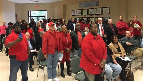 More than 40 people stood in opposition to early bar closing hours in DeKalb County at the DeKalb Commission meeting on Tuesday, Dec. 5, 2017. MARK NIESSE / MARK.NIESSE@AJC.COM