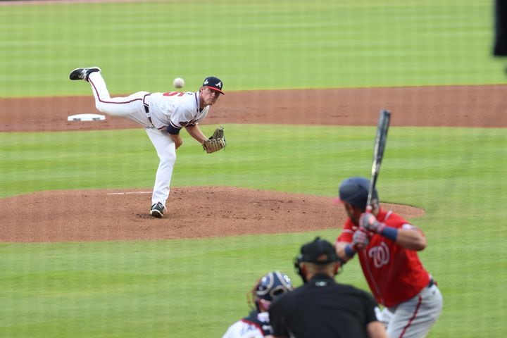 Atlanta Braves starting pitcher Bryce Elder (55) works in the first inning of a baseball game on his MLB debut against the Washington Nationals at Truist Park on Tuesday, April 12, 2022 