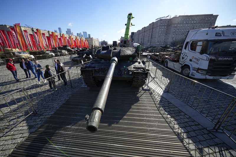 A German made Leopard 2A6 tank, hit and captured by Russian troops during the fighting in Ukraine which is seen on display in Moscow, on Wednesday, May 1, 2024. An exhibition of military equipment captured from Kyiv forces during the fighting in Ukraine has opened in the Russian capital. (AP Photo/Alexander Zemlianichenko)