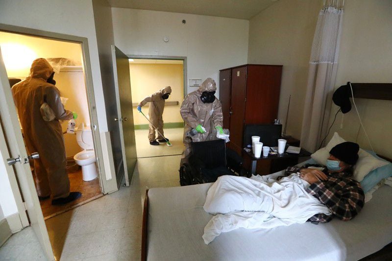 Members of the Georgia National Guard infection control team disinfect a resident's room at Legacy Transitional Care in Atlanta on April 19, 2020. (Curtis Compton / ccompton@ajc.com)