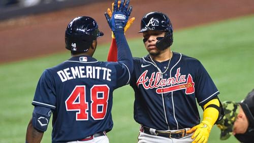 Atlanta's William Contreras (right) had been training in the outfield, but the Braves hadn’t trusted him in game action until Monday. Contreras was scheduled to start in left field for the series opener against the Phillies. (AP Photo/Gaston De Cardenas)