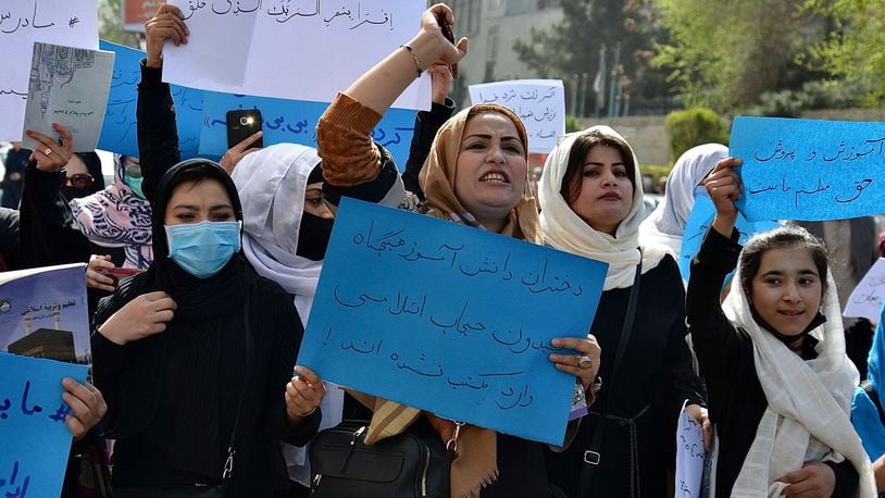Afghan women and girls take part in a protest in front of the Ministry of Education in Kabul on Saturday, March 26, 2022, demanding that high schools be reopened for girls. Guest columnist Husnia Jamal fled Taliban oppression, such as the law there that women cannot get a college education. She now lives in Georgia. (Ahmad Sahel Arman/AFP/Getty Images/TNS)