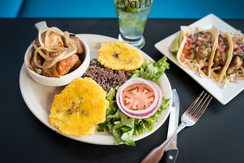  Papi’s masitas de puerco: marinated cubed pork topped with onions, served with congris, tostones and salad. CONTRIBUTED BY MIA YAKEL
