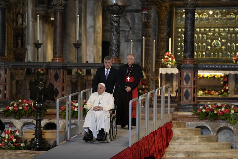 Pope Francis leaves St. Mark's Basilica in Venice, Italy, Sunday, April 28, 2024. The Pontiff arrived for his first-ever visit to the lagoon town including the Vatican pavilion at the 60th Biennal of Arts. (AP Photo/Alessandra Tarantino)
