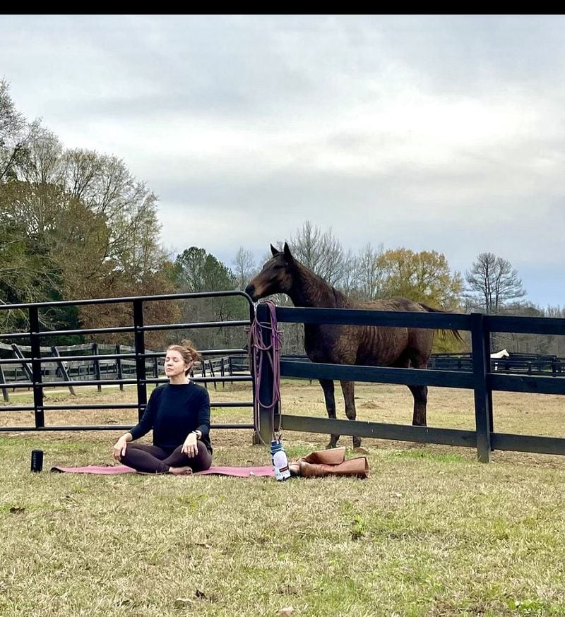 Yoga classes are sometimes held at Zorro's Crossing, while horses look on. Photo courtesy of Zorro's Crossing.