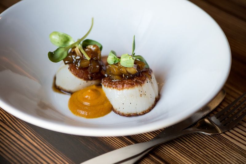  Scallops with carrot puree, green tomato chutney, and sunflower sprouts at Local Republic. Photo credit: Mia Yakel.