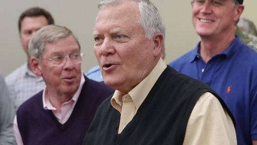 Georgia Gov. Nathan Deal, backed by U.S. Sens. Johnny Isakson (left) and David Perdue, in a 2016 file photo after Hurricane Matthew. Curtis Compton /ccompton@ajc.com