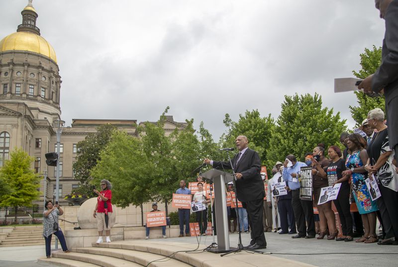 Bishop Reginald T. Jackson, seen here during a 2021 voting rights rally at Liberty Plaza, says that he’s worried about aggressive poll watchers and lawyers who could attempt to intimidate voters or election workers. “I think they intend to try to instill fear,” Jackson said. (Alyssa Pointer / AJC 2021 photo)
