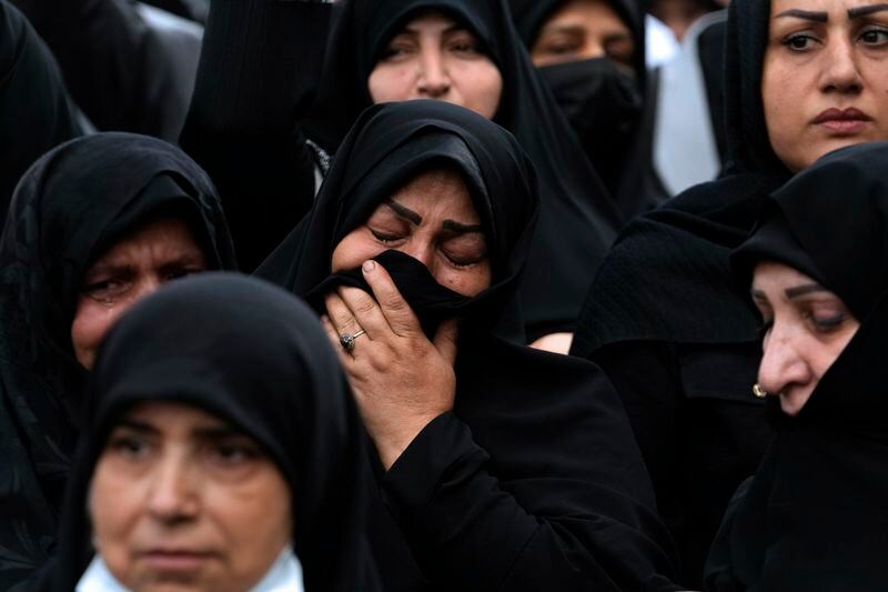 Iranian women attend a mourning ceremony for President Ebrahim Raisi at Vali-e-Asr square in downtown Tehran, Iran, Monday, May 20, 2024. President Raisi and the country's foreign minister were found dead Monday hours after their helicopter crashed in fog, leaving the Islamic Republic without two key leaders as extraordinary tensions grip the wider Middle East. (AP Photo/Vahid Salemi)