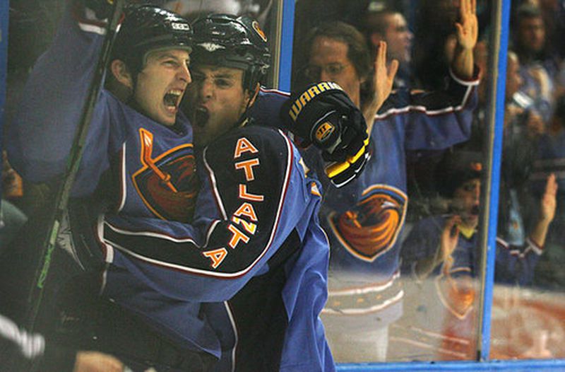 Atlanta Thrashers right wing Colby Armstrong (left) and center Marty Reasoner embrace after Armstrong scored a goal.