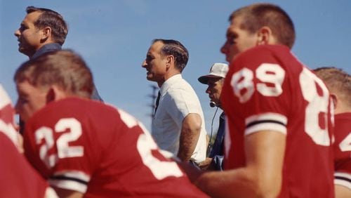 The Bulldogs lost five in a row between 1960 and 1964, before Georgia coach Vince Dooley (center) led Georgia to a huge upset of Alabama in 1965. The final score in Athens was 18-17. Later, that team would knock off No. 7 Michigan 15-7 in Ann Arbor. (AJC file photo)
