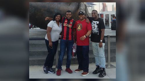 The Dunlap family (left to right) Felecia, Chris, Eric and Jordan at an Atlanta United match. Eric Dunlap is a breast cancer survivor. CREDIT: FAMILY PHOTO