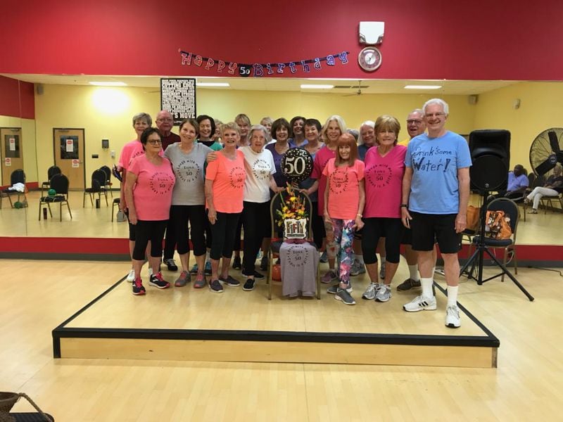 For Tona Barnes’ 50th birthday, her SilverSneakers students had T-shirts made to surprise her. One student describes the group as being more like a family. Amid the coronavirus outbreak, they are adpating to digital workouts from home.