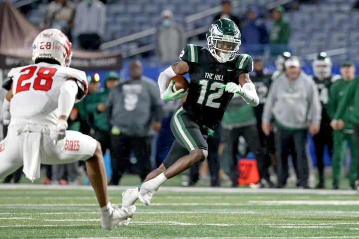 Collins Hill wide receiver Travis Hunter (12) runs after a catch against Milton during the first half of the Class 7A state title football game at Georgia State Center Parc Stadium Saturday, December 11, 2021, Atlanta. JASON GETZ FOR THE ATLANTA JOURNAL-CONSTITUTION
