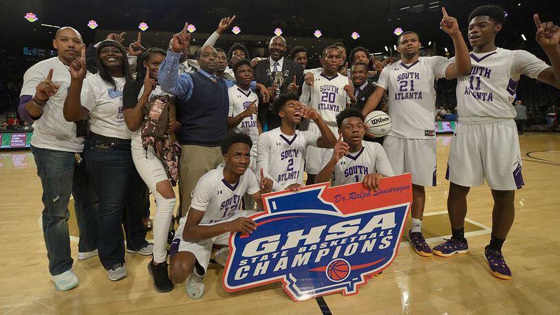 The South Atlanta Hornets celebrate their Class AA state championship win over Swainsboro at Georgia Tech Saturday.