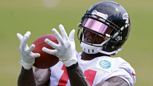 Atlanta Falcons wide receiver Julio Jones catches a pass during a NFL football training camp practice on Tuesday, August 7, 2018, in Flowery Branch.  Curtis Compton/ccompton@ajc.com