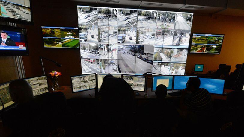 At the Atlanta police video integration center, officers keep watch over hundreds of video feeds coming in from cameras around the city. Kent D. Johnson / kdjohnson@ajc.com
