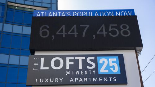 A sign outside the the Lofts at Twenty25 apartment complex displays the current population of Atlanta on Wednesday, Feb. 14, 2024. (Olivia Bowdoin for the AJC).