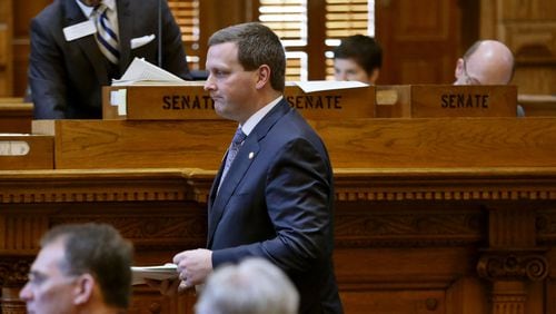 March 31, 2015 - Atlanta - Sen. Charlie Bethel, R-Dalton, heads to the well to present House Bill 429, which provides a mandate to guarantee insurance coverage of young children with autism. The bill unanimously passed. BOB ANDRES / BANDRES@AJC.COM