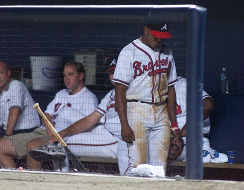 Braves outfielder Andruw Jones hangs his head as he heads to the showers after getting pulled by Bobby Cox in the middle of the 8th inning Tuesday, July 21, 1998, against the Cubs at Turner Field.