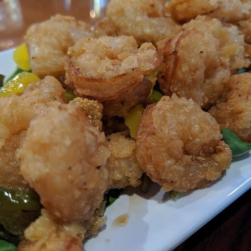 Dynamite Pepper Shrimp of deep-fried shrimp with sweet pepper sauce is among the shareable starters at new Fin & Feathers in the Sweet Auburn neighborhood downtown. LIGAYA FIGUERAS/LFIGUERAS@AJC.COM.