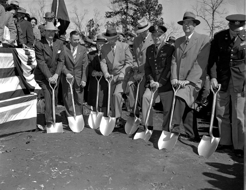 Gov. Herman Talmadge (from left), H. Weldon Gardner, E.L. Hart, Mayor W.B. Hartsfield, Larry Kleckley, Col. B.L. Robinson, and Ray Otwell push on shovels as ground was broken Wednesday, March 2, 1950, for the start of construction on Buford Dam.