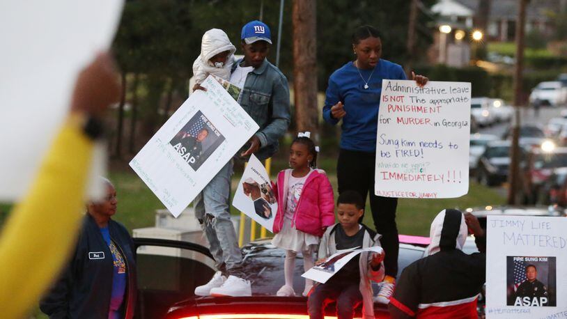 3/19/19 - Atlanta  - People protest the way the death of 21-year-old Jimmy Atchison was handled by officials outside of a town hall hosted by Atlanta Mayor Keisha Lance Bottoms at Cascade United Methodist Church in Atlanta, Georgia on Tuesday, March 19, 2019. EMILY HANEY / emily.haney@ajc.com