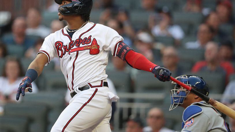 Ronald Acuna hits leadoff single against the New York Mets on Tuesday, Aug. 13, 2019, in Atlanta.