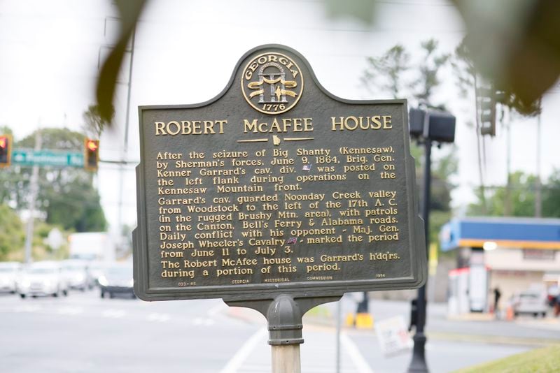 The sign on the side of the historic house shows part of what happened almost two centuries ago. The Eliza and Robert McAfee house in Marietta is in the midst of a dispute to find a solution for its fate.
Miguel Martinez /miguel.martinezjimenez@ajc.com