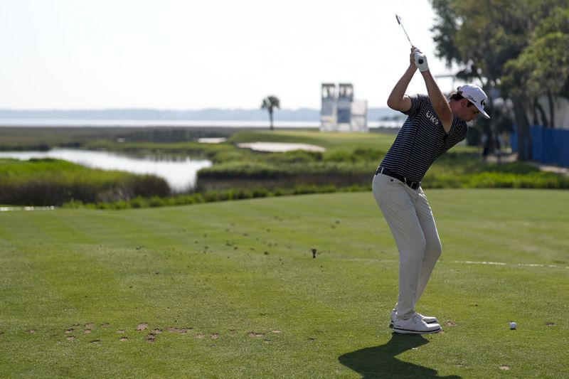 J.T. Poston hits his tee shot on the 18th hole during the second round of the RBC Heritage golf tournament, Friday, April 19, 2024, in Hilton Head Island, S.C. (AP Photo/Chris Carlson)