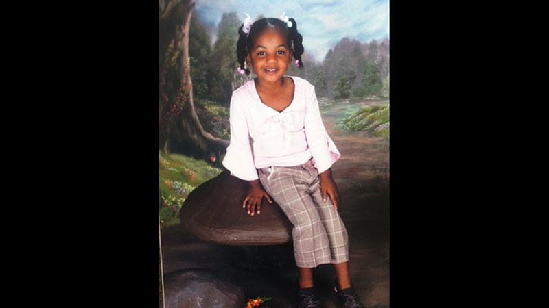 Ten-year-old Emani Moss weighed just 32 pounds when her charred body was discovered in a trash can on Nov. 2, 2013. Her stepmother has been convicted of her murder.