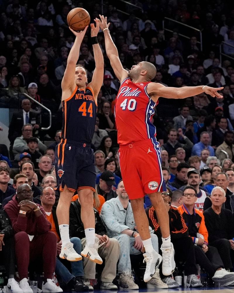 Philadelphia 76ers' Nicolas Batum (40) defends against a shot by New York Knicks' Bojan Bogdanovic (44) during the second half of Game 2 in an NBA basketball first-round playoff series Monday, April 22, 2024, in New York. (AP Photo/Frank Franklin II)