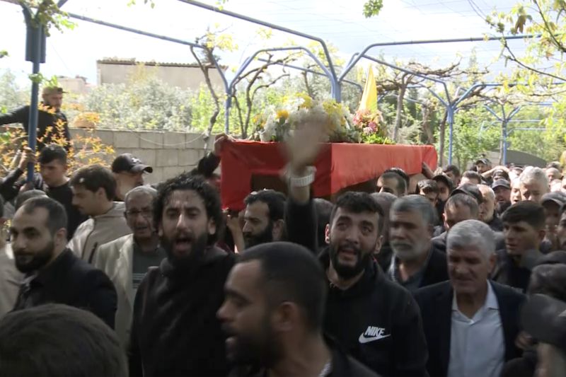 In this grab taken from video, mourners carry the coffin of Lebanese money changer Mohammad Srour, 57, who was found tortured and killed inside a villa in Monte Verdi neighborhood of Beit Meri, during his funeral procession in Labweh village, near the border with Syria, northeast Lebanon, Thursday, April 11, 2024. The mysterious abduction and murder of a United States-sanctioned Lebanese money changer in a three-story villa on the edge of a quiet mountain resort town overlooking Beirut was most likely the work of Israeli operatives, Lebanon's interior minister said Wednesday. (AP Photo)