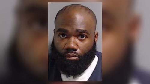 Reynard Trotman is accused of aiding and abetting a crime and failing to render aid or protect an inmate from physical harm, Fulton County Sheriff Pat Labat said.