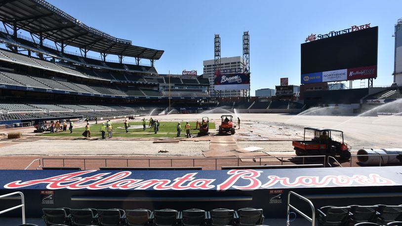 File Photo: Workers install sod in the infield at SunTrust Park on Saturday, March 4, 2017. HYOSUB SHIN / HSHIN@AJC.COM