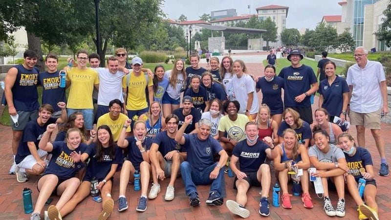 Emory University President Gregory L. Fenves, seated in the front row wearing a blue T-shirt and jeans, is joined by several dozen students and others on campus at the start of the fall 2021 semester. Emory is launching a no-loan effort for lower-income undergraduate students. (Courtesy of Emory University)