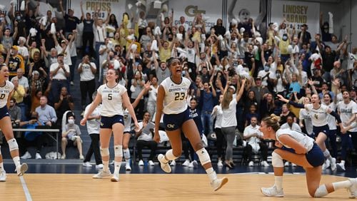 The Georgia Tech volleyball team celebrates winning match point of its first-round NCAA Tournament win over The Citadel December 3, 2021 at O'Keefe Gymnasium. (Danny Karnik/Georgia Tech Athletics)