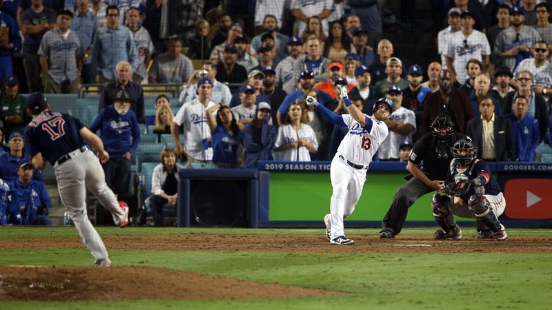Dodgers' Max Muncy hits a walk-off home run in the 18th inning to beat the Boston Red Sox in Game 3 of the 2018 World Series Friday, Oct. 26, 2018, at Dodger Stadium in Los Angeles.