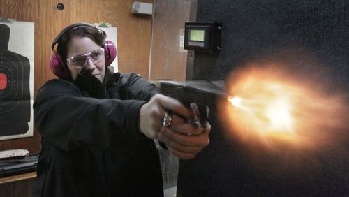 Sydni Lee fires her Glock 19 at a gun range in Cumming in 2013. A Massachusetts man says he was target practicing with a Glock when it exploded in his hands, seriously injuring him. BOB ANDRES BANDRES@AJC.COM