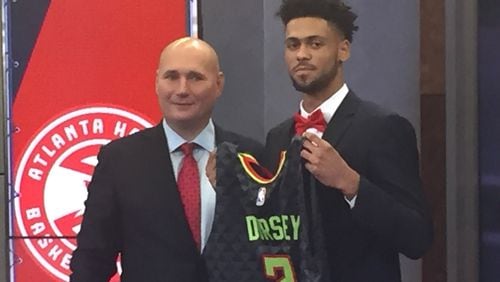 Tyler Dorsey (right) and Hawks general manager Travis Schlenk unveil his jersey at an introductory press conference on Monday. Photo by Chris Vivlamore
