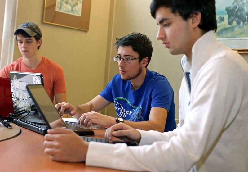 Southern Polytechnic State University freshman Doug Baldwin, of Cumming, left, Sam Shackleford, also of Cumming, center, and Liel Vanderhoeven, of Roswell, study for their finals on campus Thursday morning in Marietta, Ga., December 5, 2013. Photo by Jason Getz / AJC