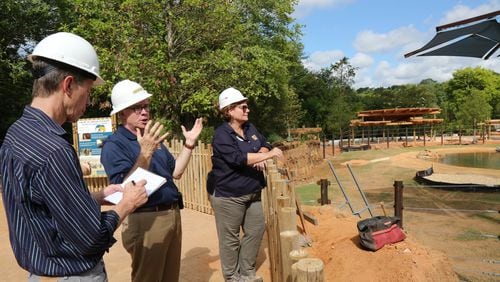 Raymond B. King, president and CEO at Zoo Atlanta (center), and Dr. Hayley Murphy (right) deputy director of Zoo Atlanta, speak to an AJC reporter about the new African Savanna elephant habitat.