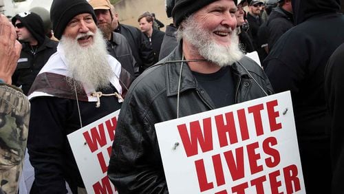 People hold signs during a "White Lives Matter" rally on October 28, 2017 in Shelbyville, Tennessee. Tennessee Gov. Bill Haslam said state and local law enforcement officials would be out "in full force" for the two white nationalist rallies. The event billed as a White Live Matter rally is hosted by Nationalist Front, which is a coalition of several white supremacist organizations.