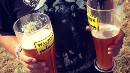 A festival-goer holds two glasses of beer at the 2014 Wacken Open Air heavy metal music festival on on August 1, 2014 in Wacken, Germany. Wacken is a village in northern Germany with a population of 1,800 that has hosted the annual four-day festival, which attracts 75,000 heavy metal fans from around the world, since 1990.  (Photo by Sean Gallup/Getty Images)