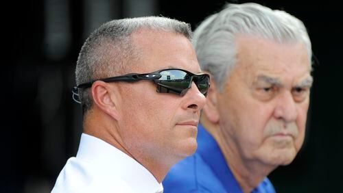 Kansas City Royals' general manager Dayton Moore and owner David Glass watch the Royals take batting practice prior to a game against the Chicago White Sox  at Kauffman Stadium on August 9, 2016 in Kansas City, Missouri. (Photo by Ed Zurga/Getty Images)