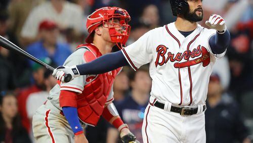 Braves outfielder Nick Markakis hits a walk off 3-RBI home run to beat the Phillies 8 to 5 in a MLB baseball home opening game on Thursday, March 29, 2018, in Atlanta.  Curtis Compton/ccompton@ajc.com