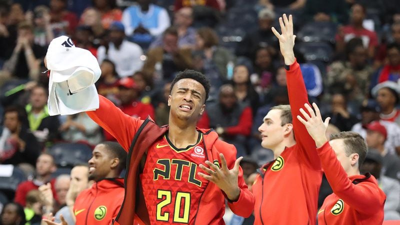 Hawks forward John Collins leads the cheers off the bench after Dennis Schroder hits a 3-pointer  against the Cavaliers in a NBA basketball game on Thursday, November 30, 2017, in Atlanta.  Curtis Compton/ccompton@ajc.com