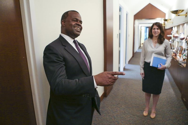 Then-Mayor Kasim Reed, left, and press secretary Jenna Garland appear in this September 2015 file photo. Garland was charged with two misdemeanor counts of violating the Georgia Open Records Act, the first-ever charges filed in state history for violations of state sunshine law. JOHN SPINK / JSPINK@AJC.COM